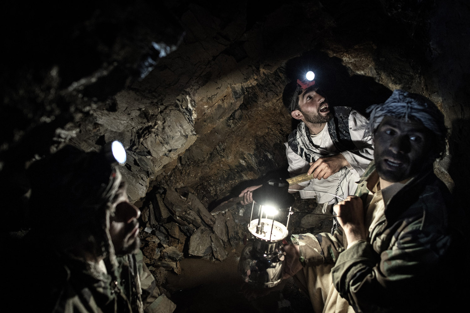 Panjshir Valley in north-central Afghanistan May 2013:Workers in an emerald mine in Panjshir. The illegal mines are pitch black and workers work by headlamp, flashlight and kerosenelamp.