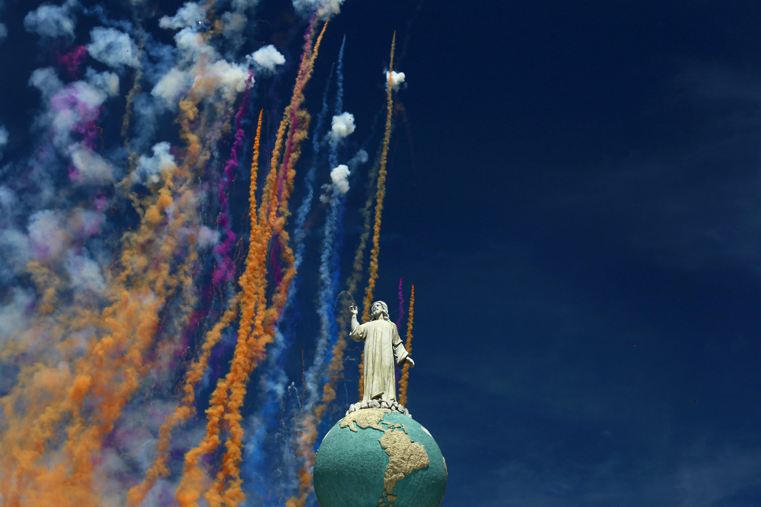 Aug. 1, 2013. Fireworks are seen behind the Divino Salvador del Mundo monument during  Agostinas  (in allusion to the August month) religious celebrations in San Salvador.