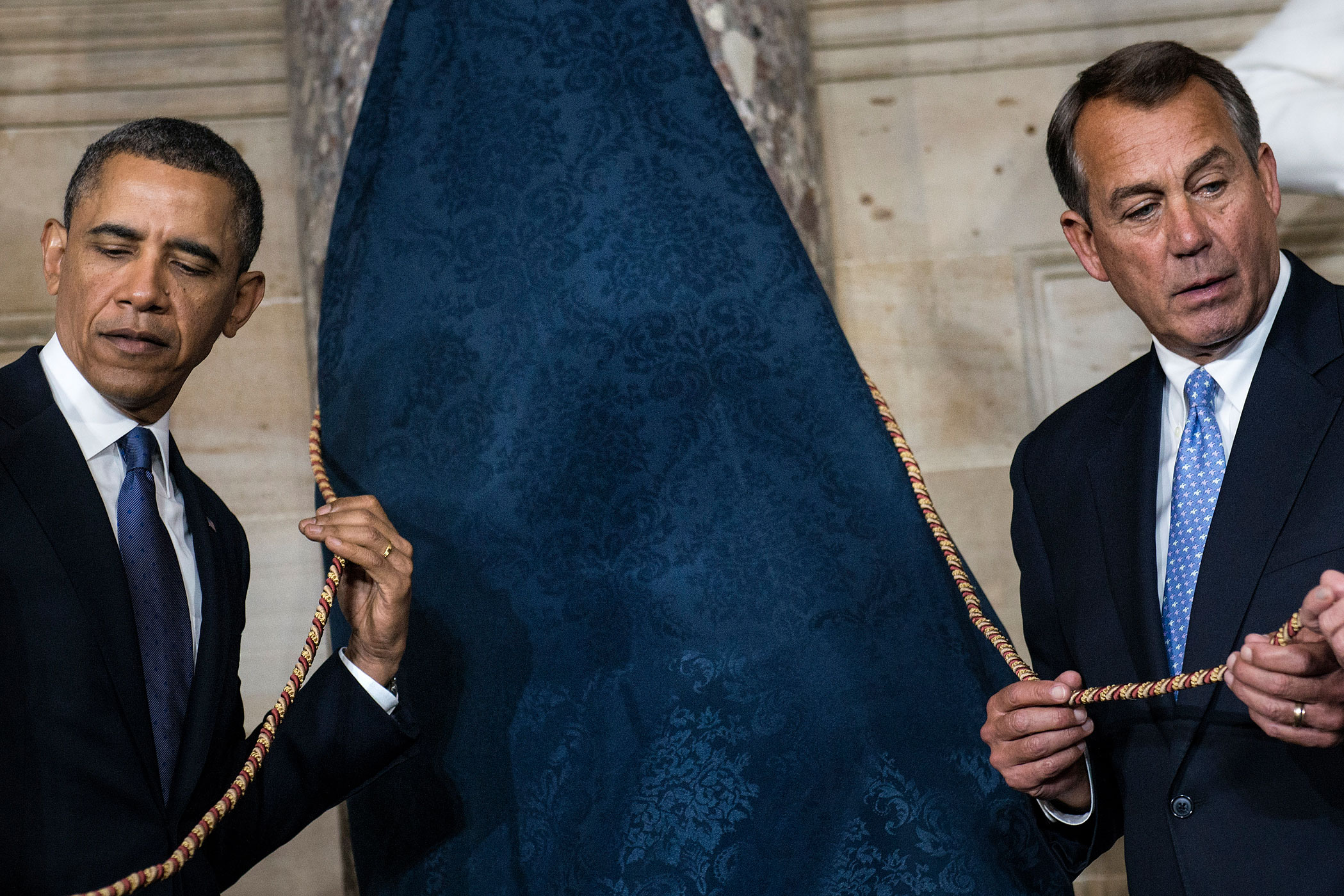 Feb. 27, 2013. President Barack Obama and Speaker of the House John Boehner wait to unveil a statue of Rosa Parks during an unveiling in Statuary Hall on Capitol Hill in Washington.