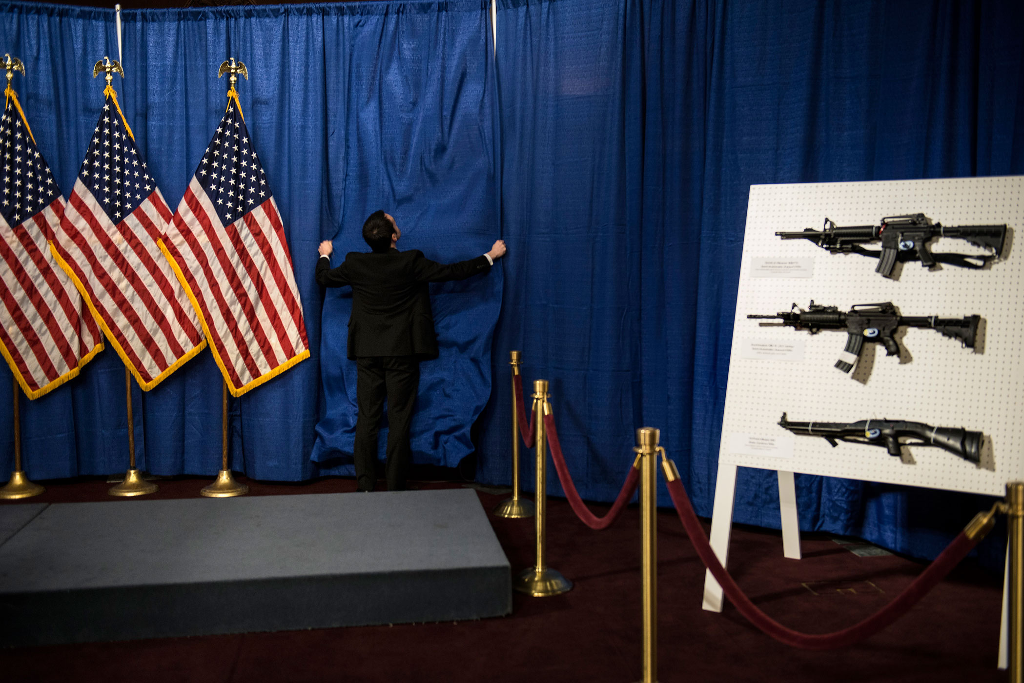 Jan. 24, 2013. A Senate staff member prepares for a press conference on Capitol Hill in Washington. House and Senate Democrats where joined by law enforcement officials to introduce the  Assault Weapons Ban of 2013.