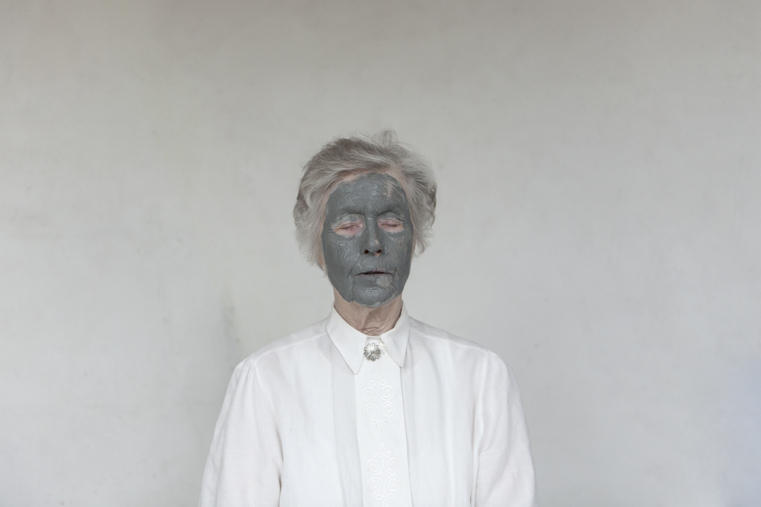 Portrait taken just after participant made her face imprint into the canvas. Iceland, 2011.