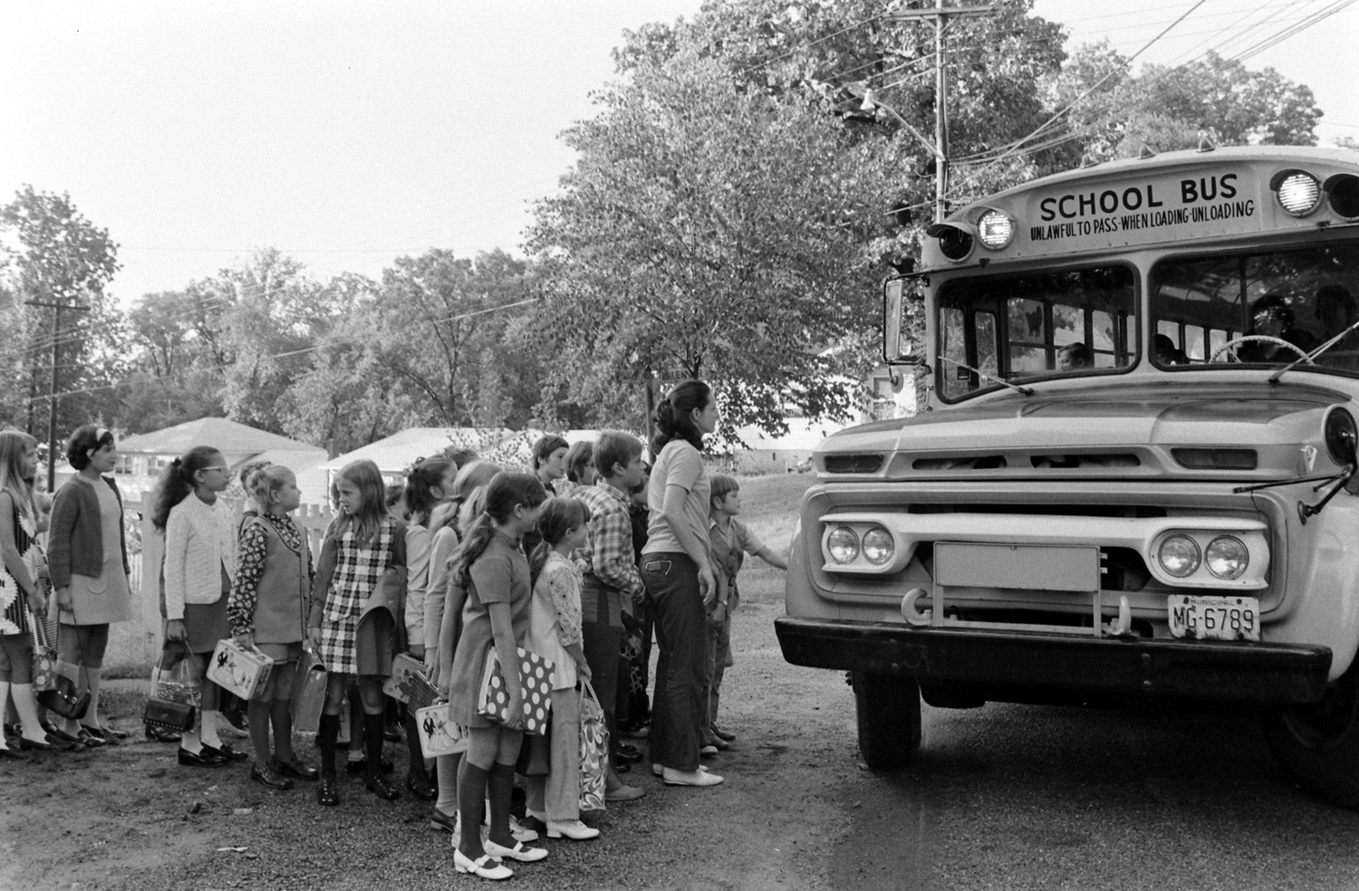 School bus stop, New Jersey, 1971
