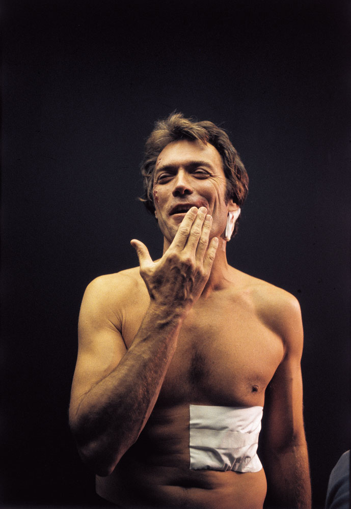 Swathed in bandages after a brutal beating scene in Dirty Harry, Eastwood rarely escapes mayhem in films. His fans appreciate that he gives more than he takes.  - Caption from LIFE Magazine
