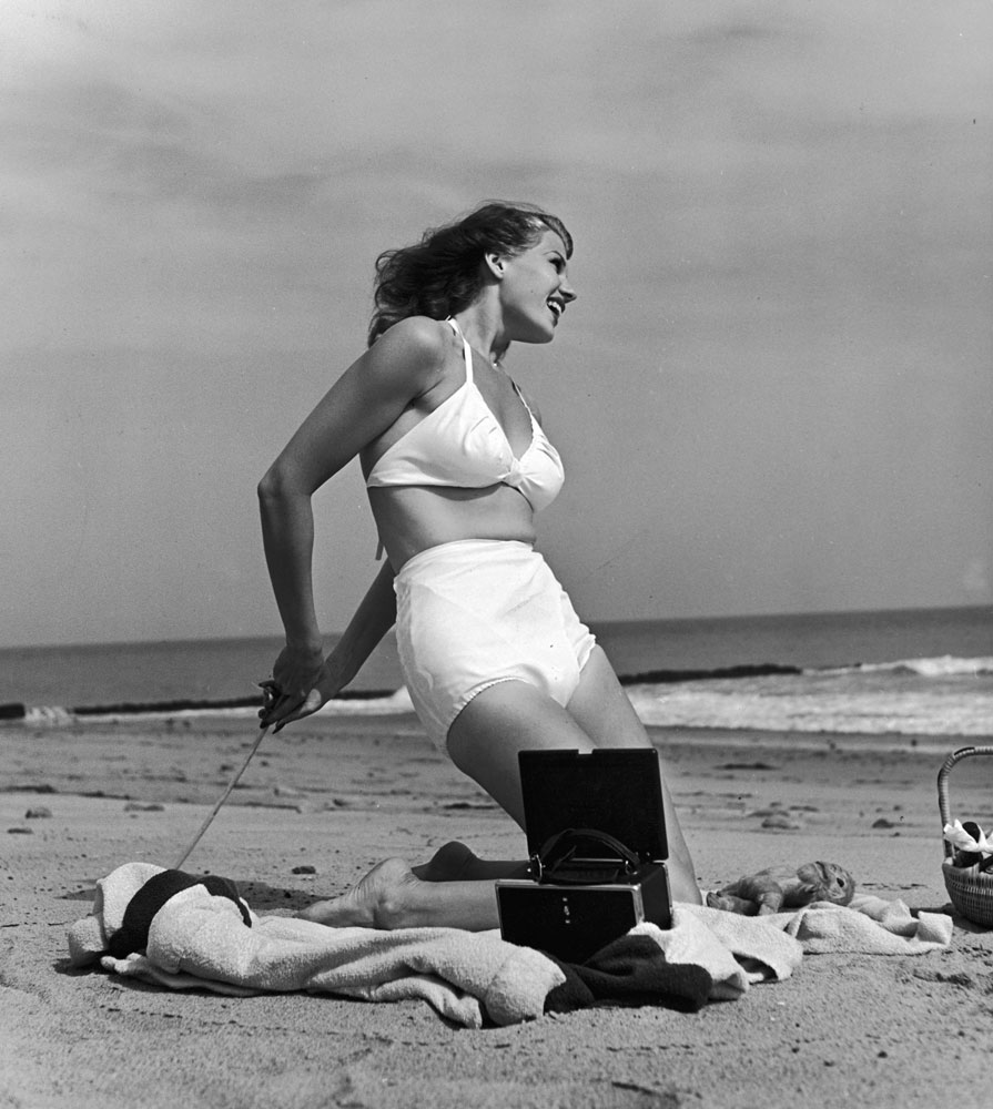 Rita Hayworth on the beach, 1941.