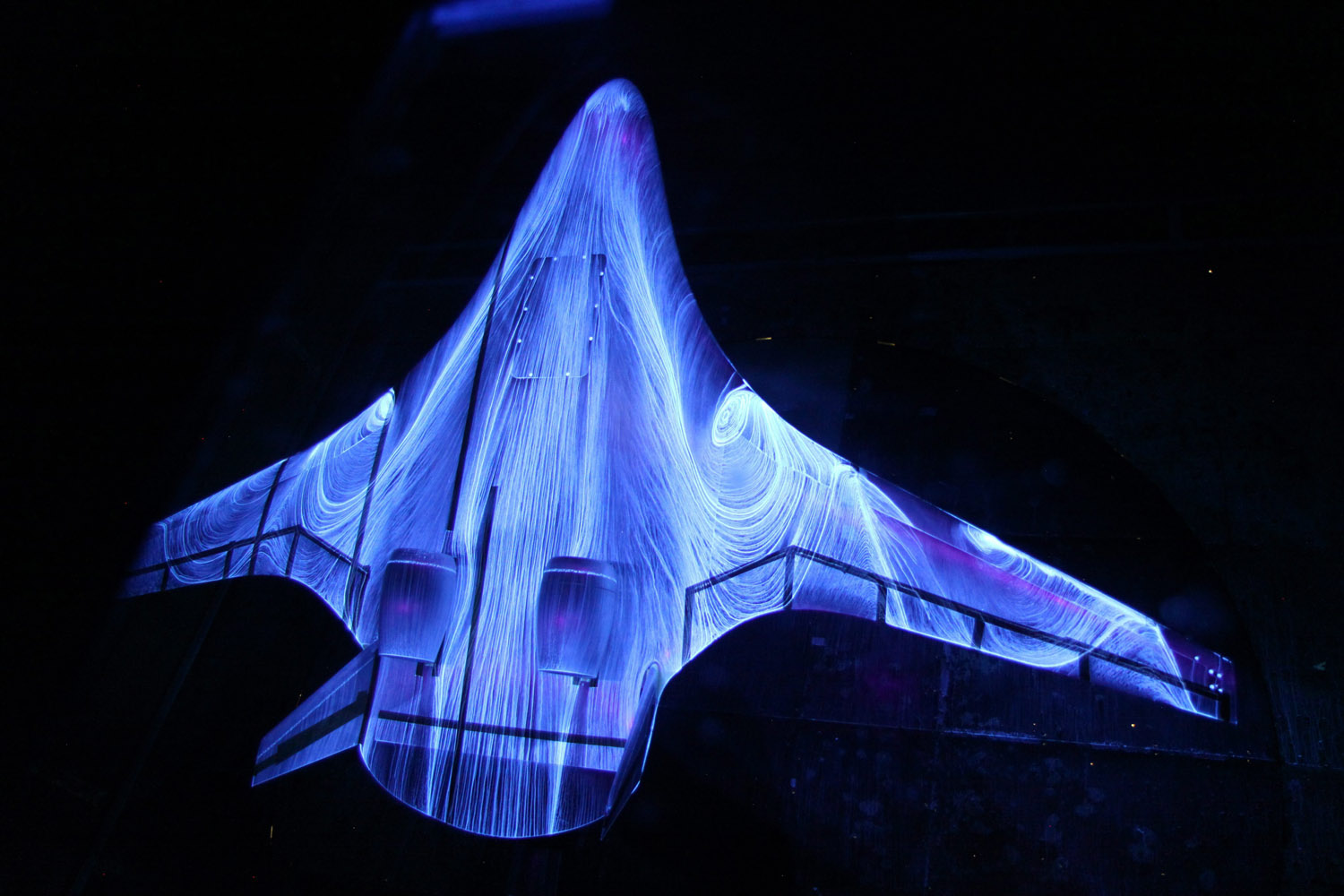 Sept. 29, 2013. A fluorescent oil is sprayed on a 5.8 percent scale model of a futuristic hybrid wing body during tests in the 14 by 22 foot Subsonic Wind Tunnel in Langley Research Center in Hampton, Va.