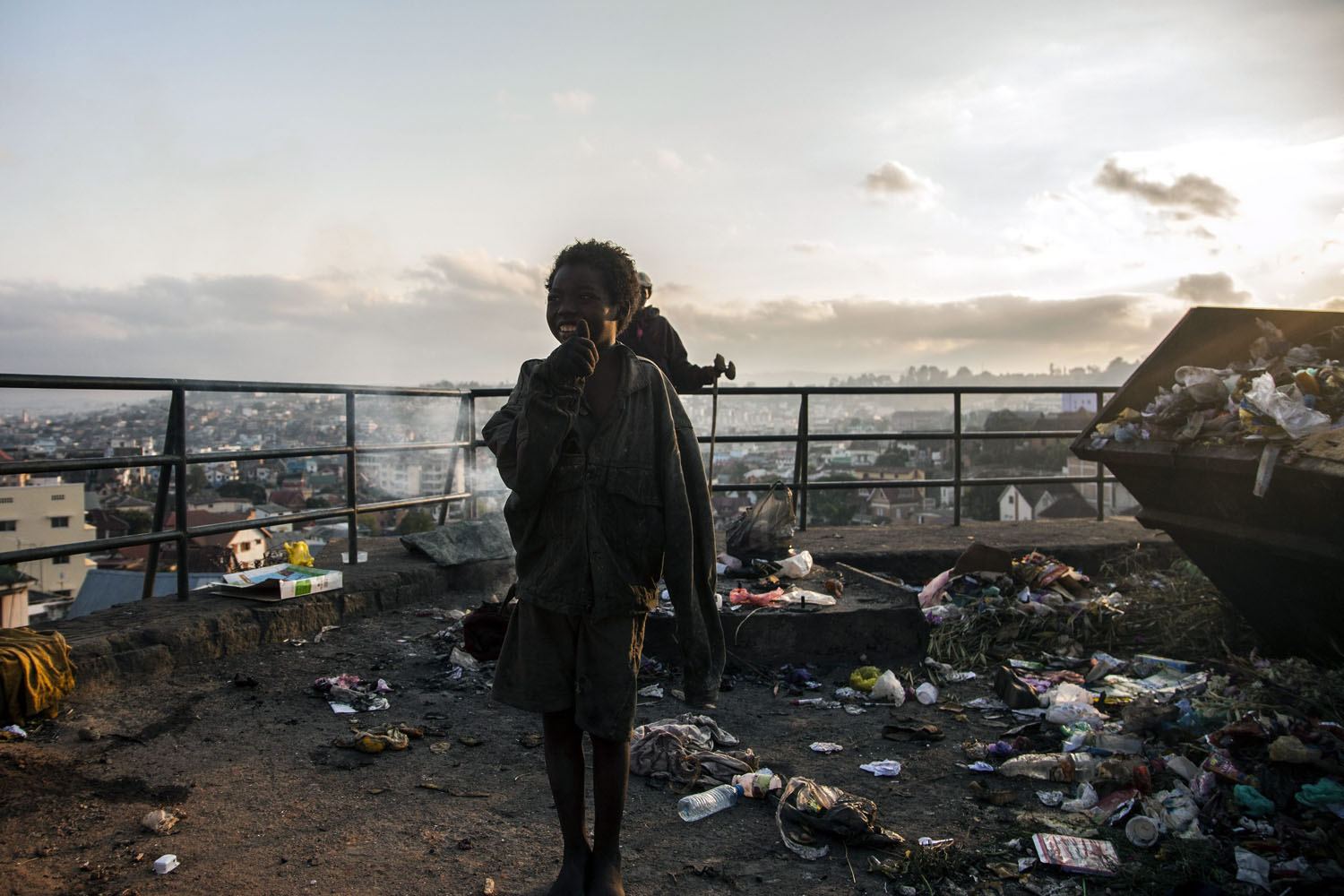 Oct. 25, 2013. A Malagasy homeless child watches the sunrise prior the Presidential Election in Antananarivo, Madagascar.