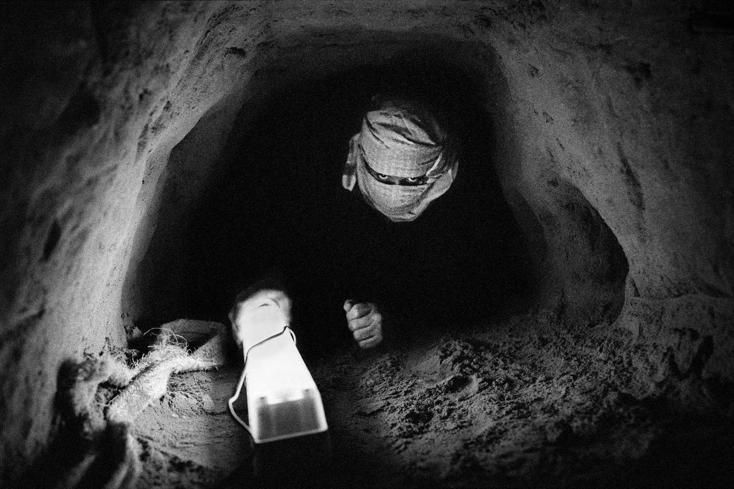 Inside a tunnel between the Gaza Strip and Egypt near Rafah, Gaza Strip, 2006. These tunnels are used to smuggle weapons and ammunition but also as a lifeline between Gaza and the outside world.