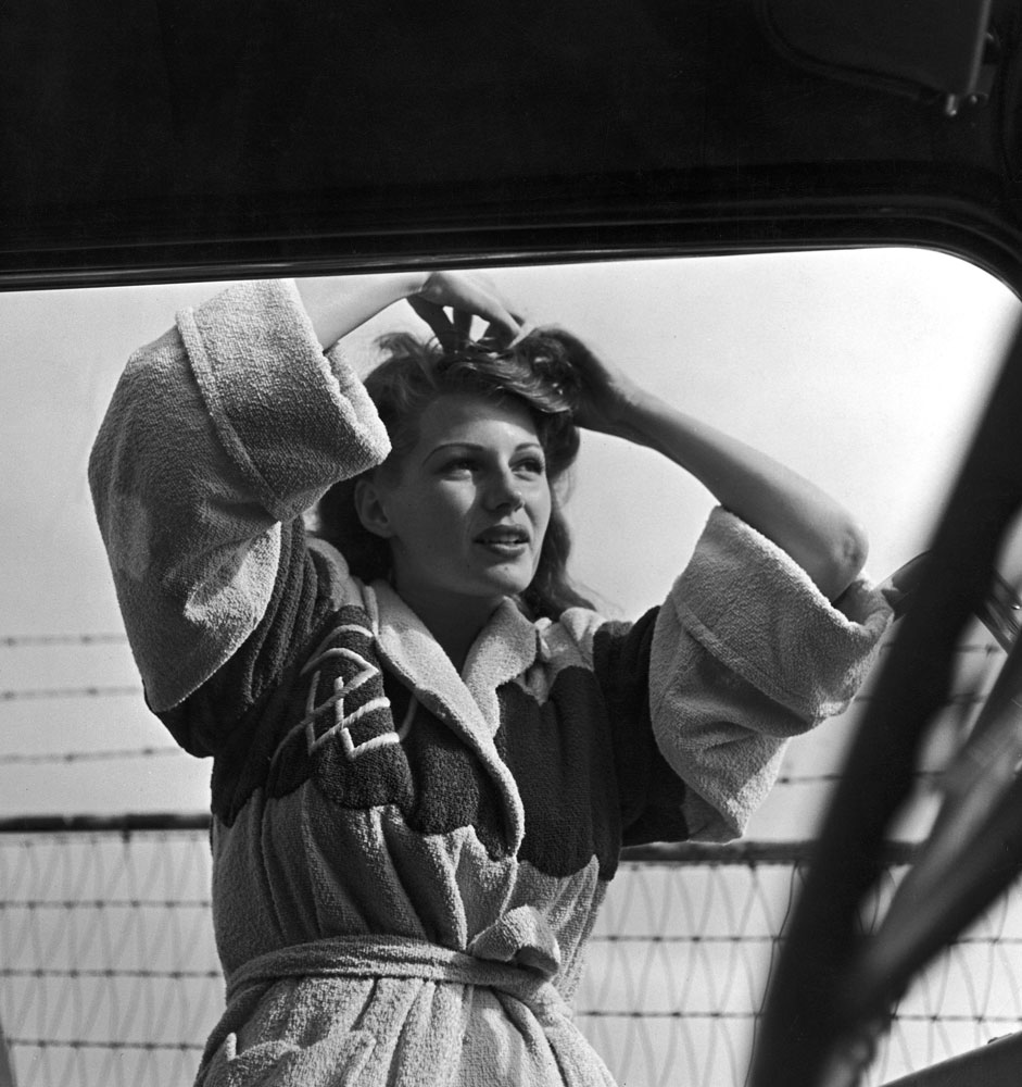 Rita Hayworth, photographed through a car window, 1941.