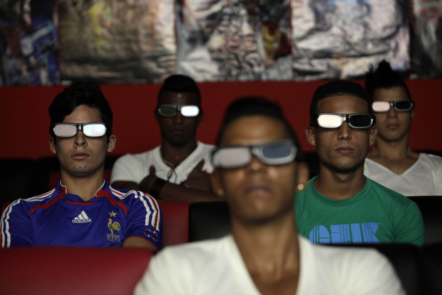 Oct. 28, 2013. People watch a 3D movie at a private movie theater in Havana, Cuba.