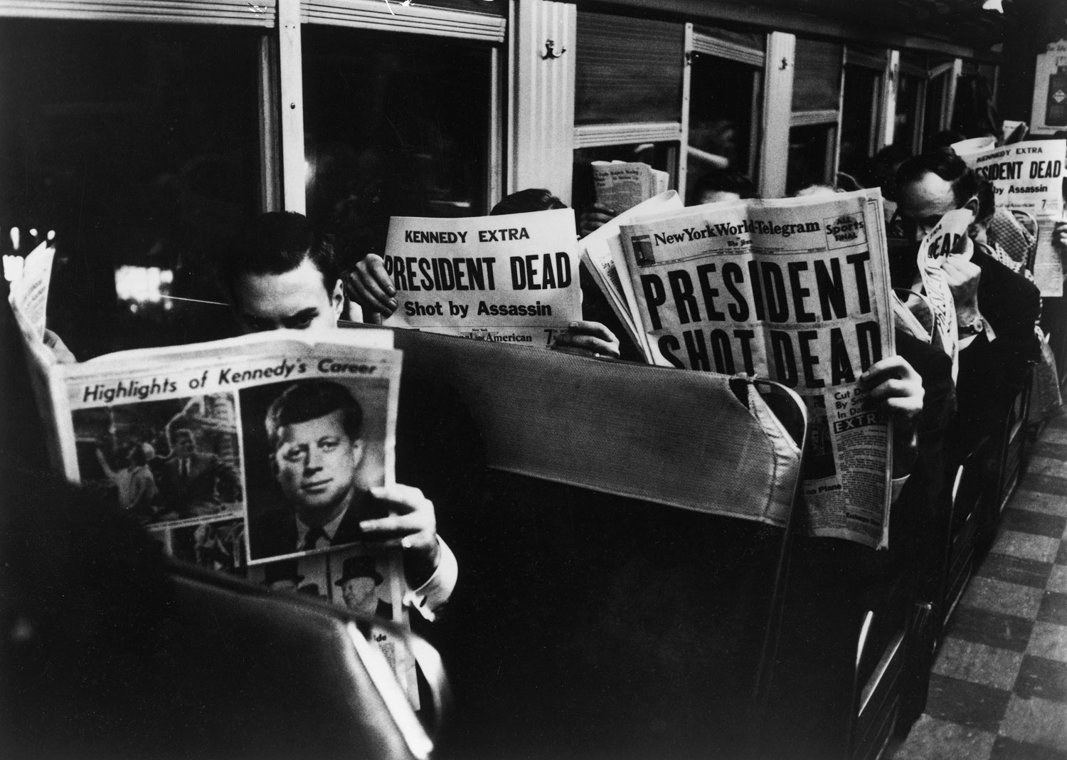 Commuters in New York City read of John F. Kennedy's assassination, Nov. 22, 1963.