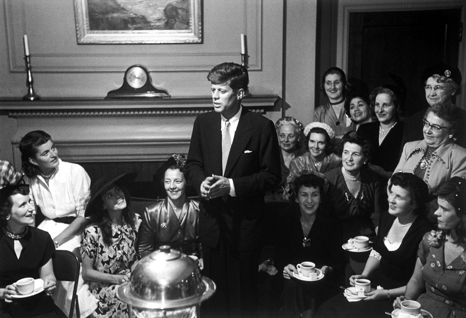 Senatorial candidate John F. Kennedy attends a tea party given by female supporters, 1952.