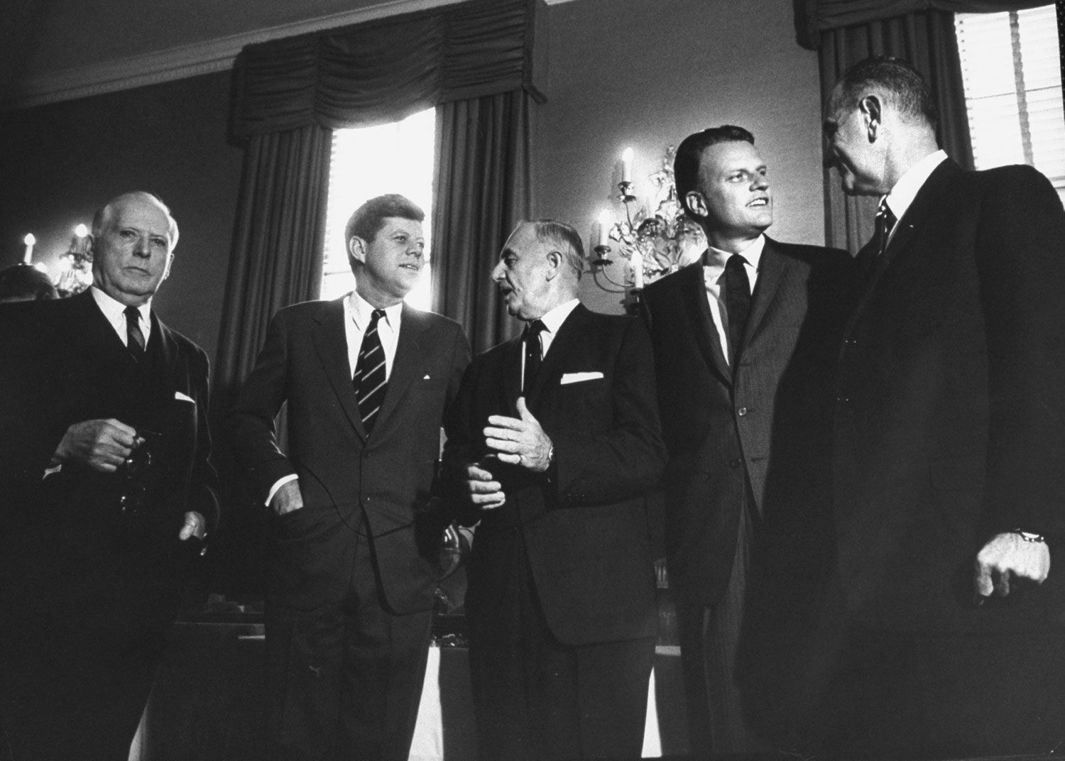 Boyd Leedom(member of the National Labor Relations Board), President John F. Kennedy, Senator Frank W. Carlson, the Rev. Billy Graham and Vice President Lyndon B. Johnson, 1961.
