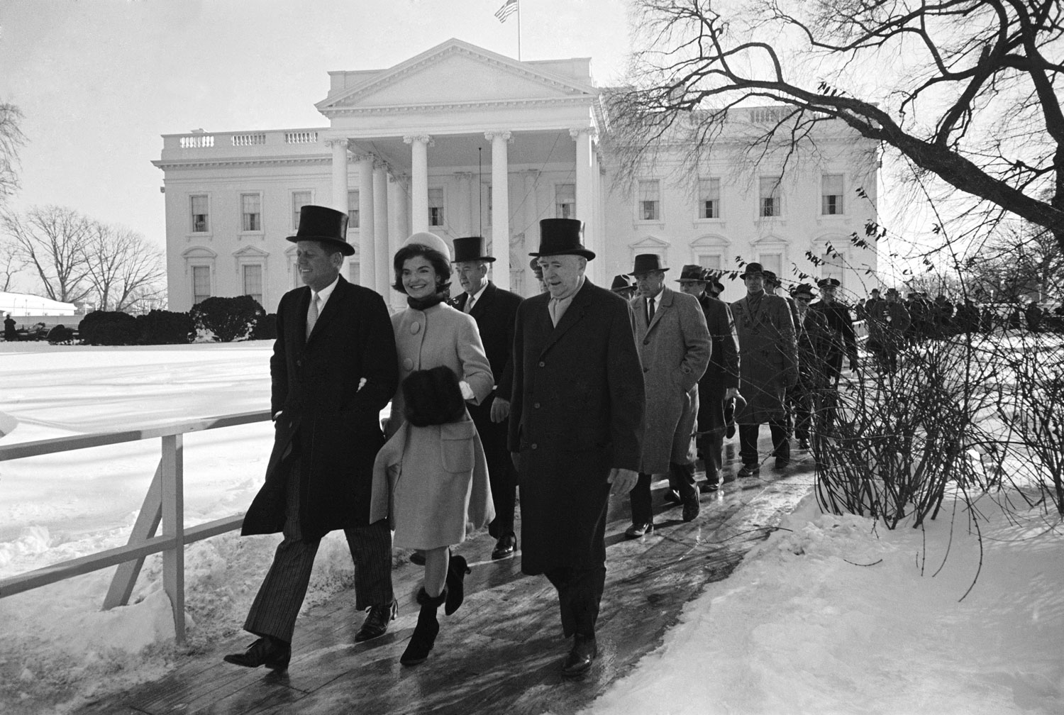 President-elect John F. Kenned, his wife Jackie and others walking to JFK's inauguration, January 1961.