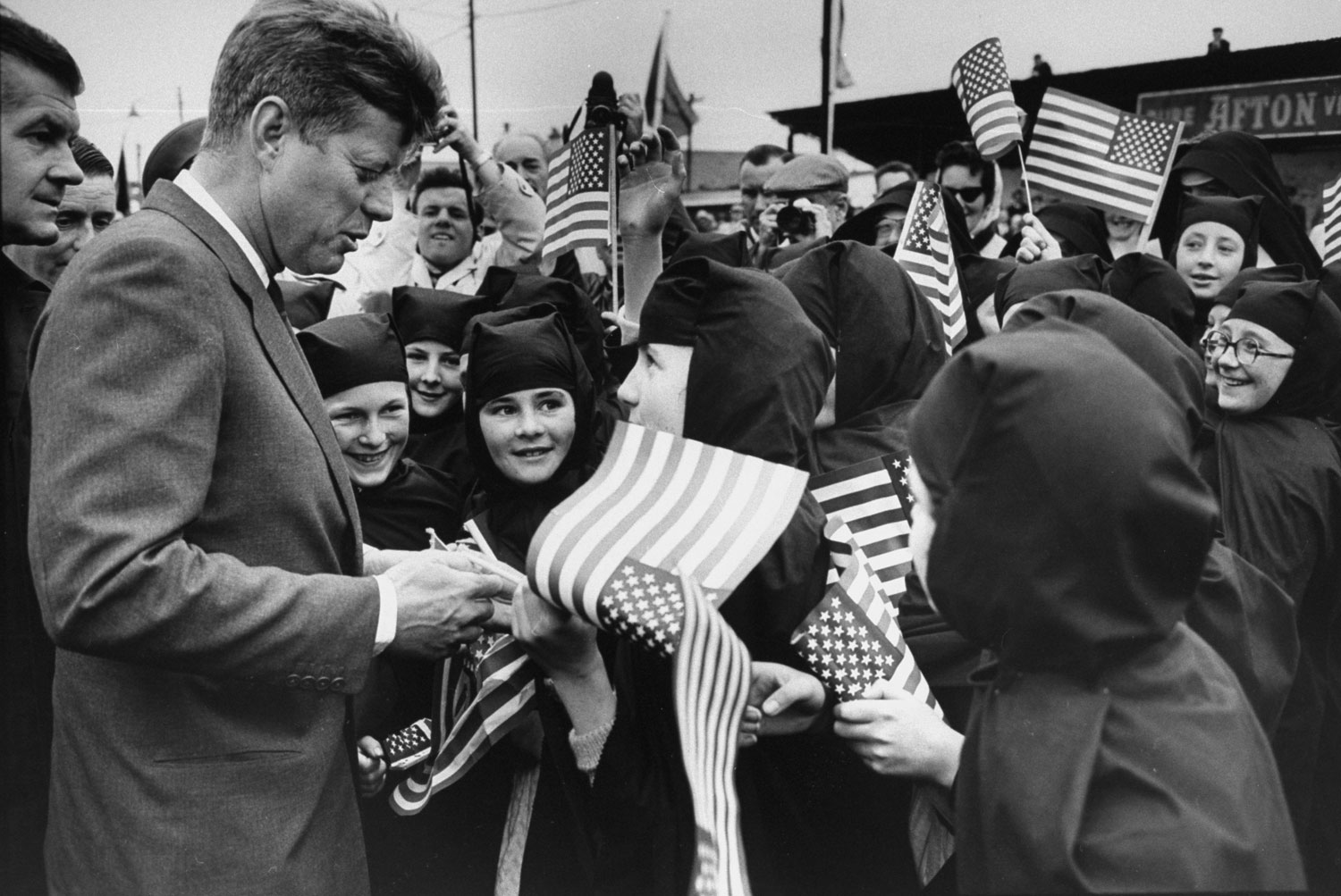 President John Kennedy signs autographs during his landmark visit to Ireland in June 1963.