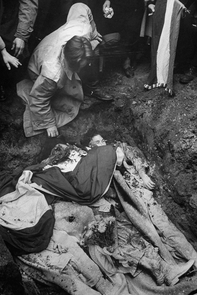 Burying the dead, Hungary, 1956.