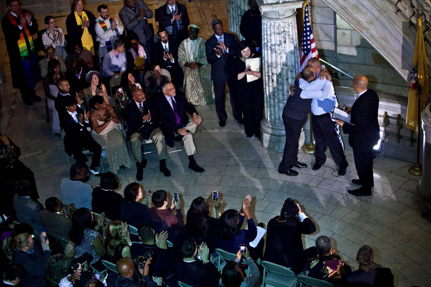 Oct. 21, 2013. Alexander Padilla and Anthony Arenas hug each other after being married by Newark Mayor and newly-elected U.S. Senator Cory Booker at City Hall in the early morning hours in Newark, N.J.