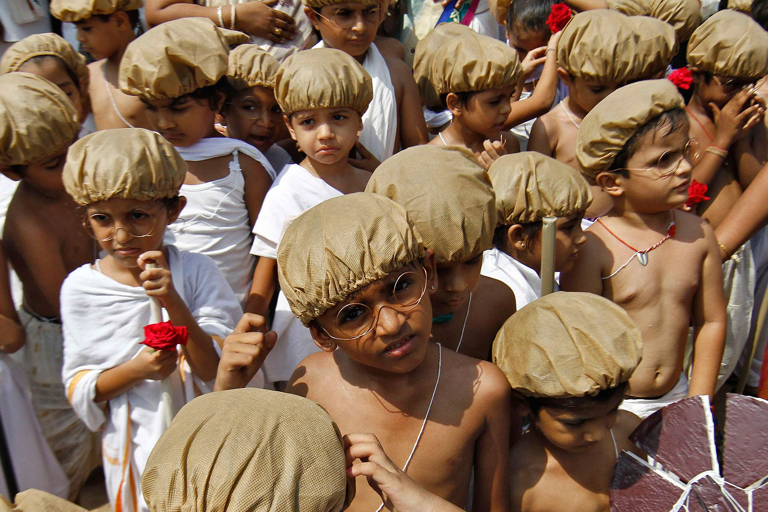 School children dressed as Mahatma Gandhi participate in celebrations marking the 144th birth anniversary of Gandhi, in the southern Indian city of Chennai