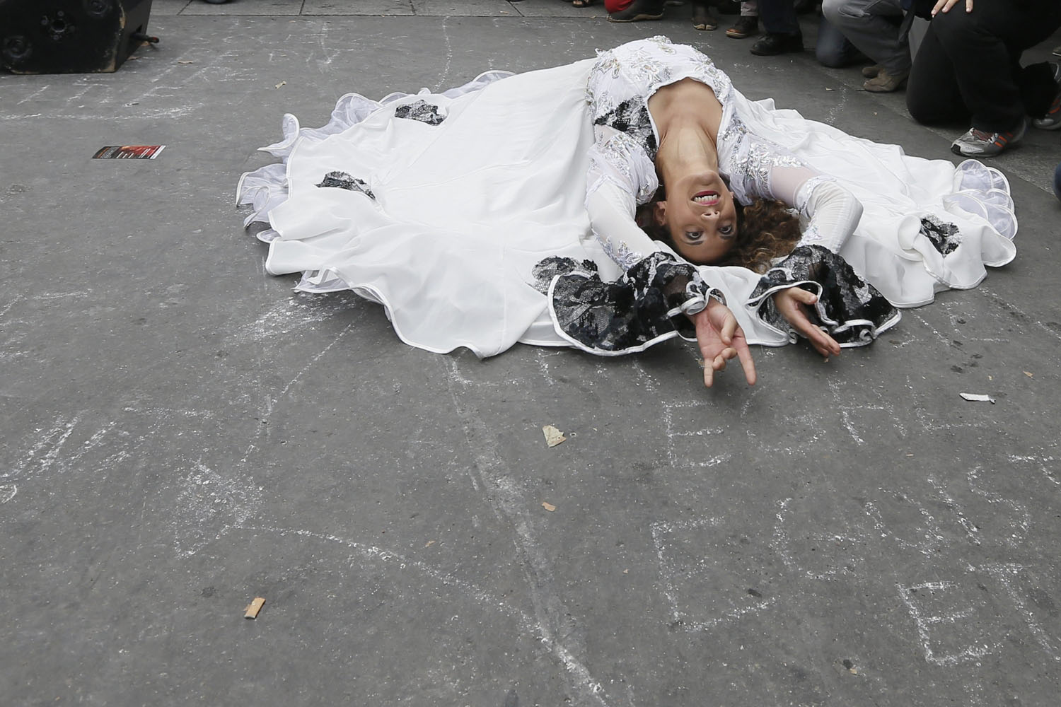 A Roma woman dances as she attends a gathering called "Roma Pride against Racism, and For Equality" in Paris