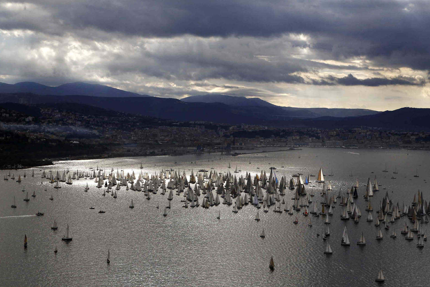 Sailing boats gather at the start of the Barcolana regatta in front of Trieste harbour