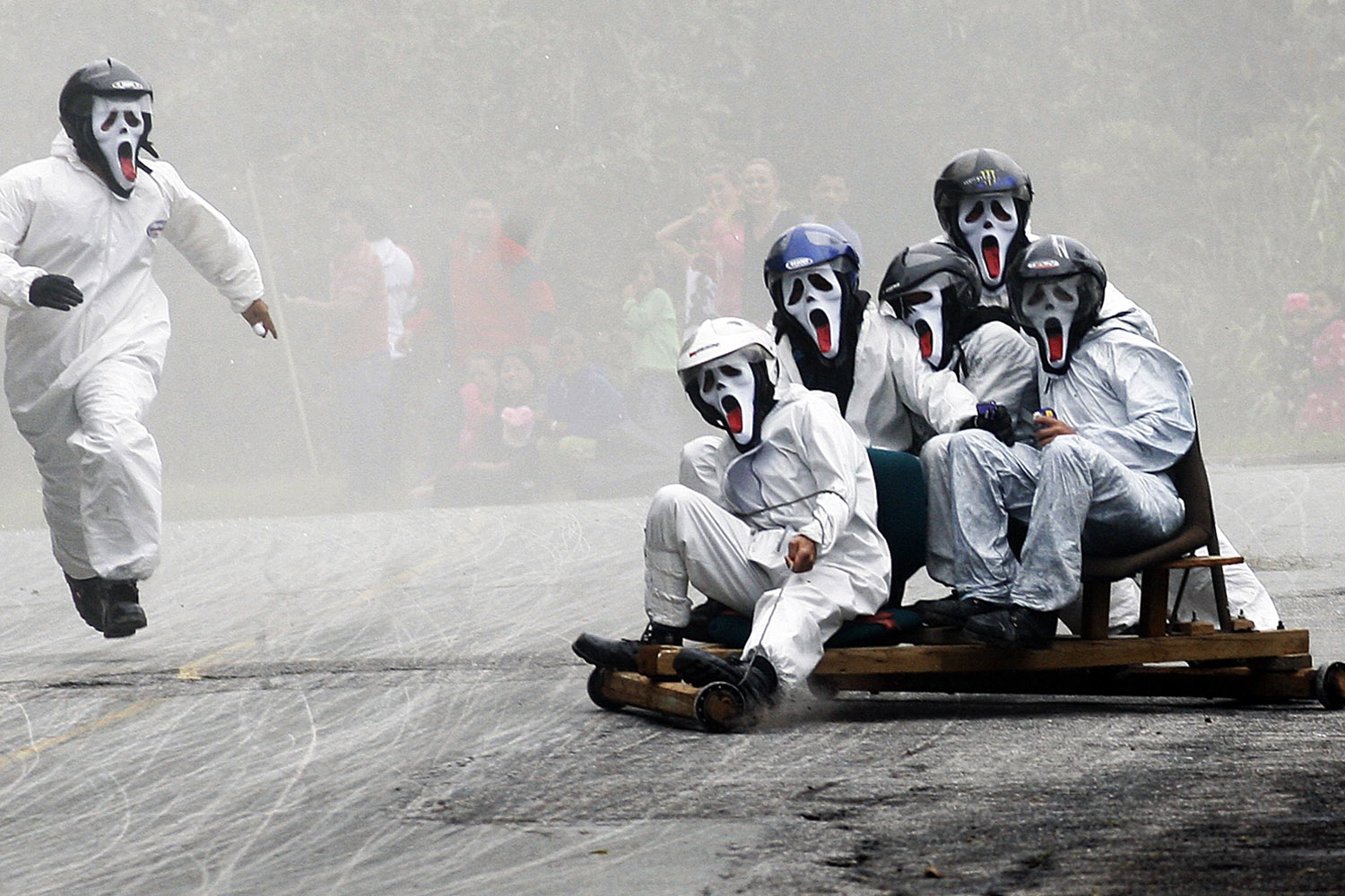 Participants descend a hill on a homemade roller cart during the 25th Roller Cart Festival in Medellin