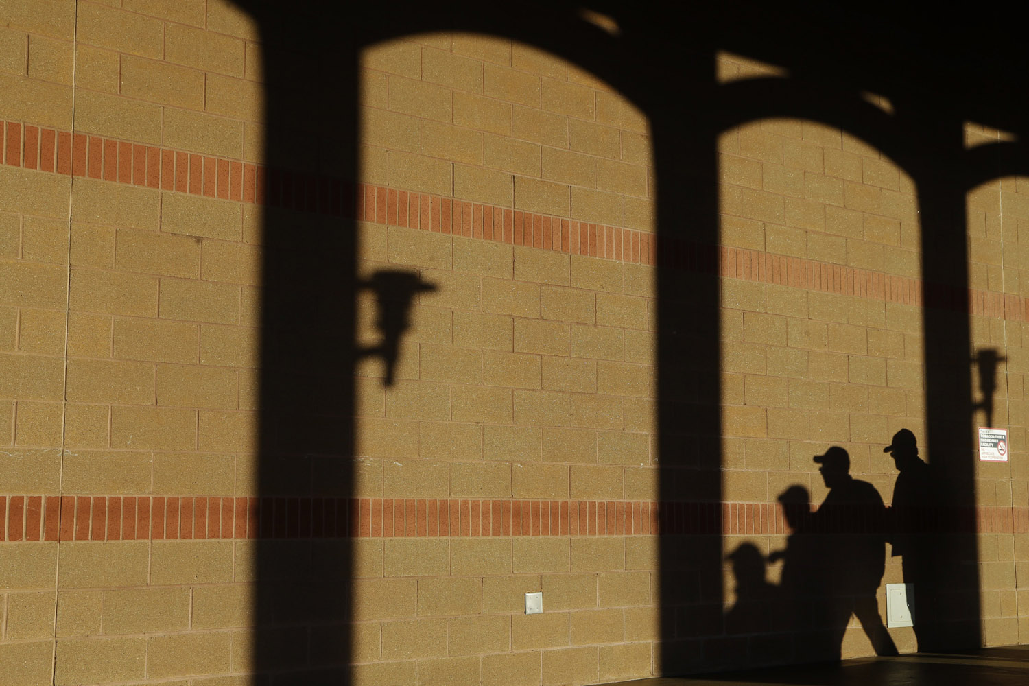 Oct. 27, 2013. Baseball fans are silhouetted outside of Busch Stadium before Stadium  Game 4 of baseball's World Series between the St. Louis Cardinals and the Boston Red Sox.