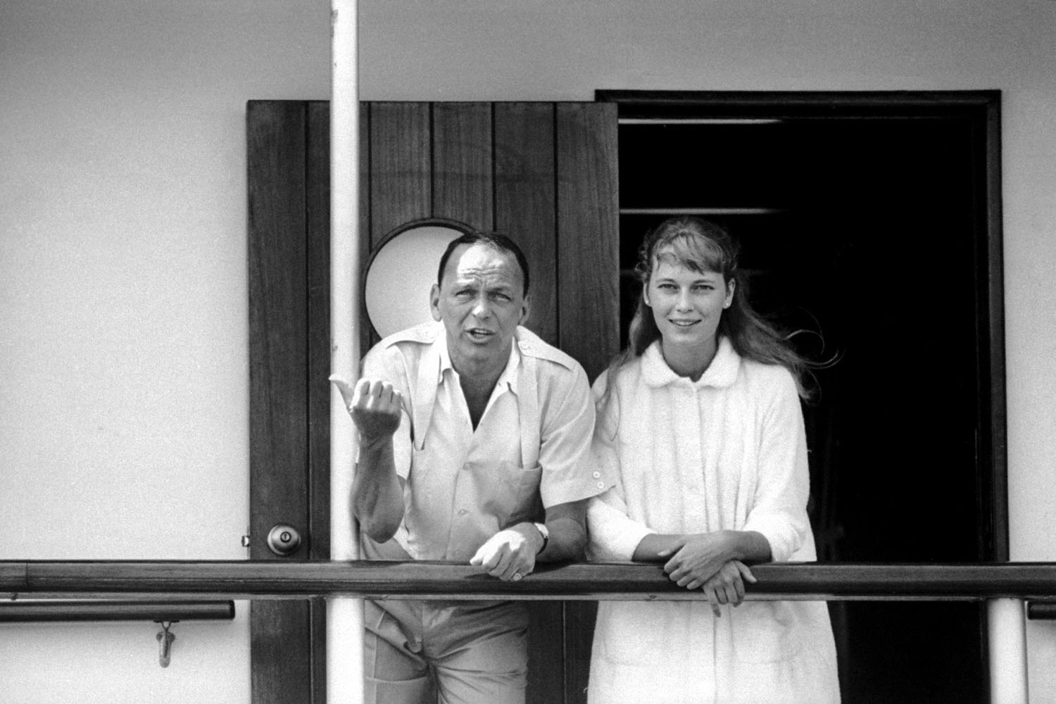 Singer Frank Sinatra with actress girlfriend Mia Farrow on deck of the yacht Southern Breeze.