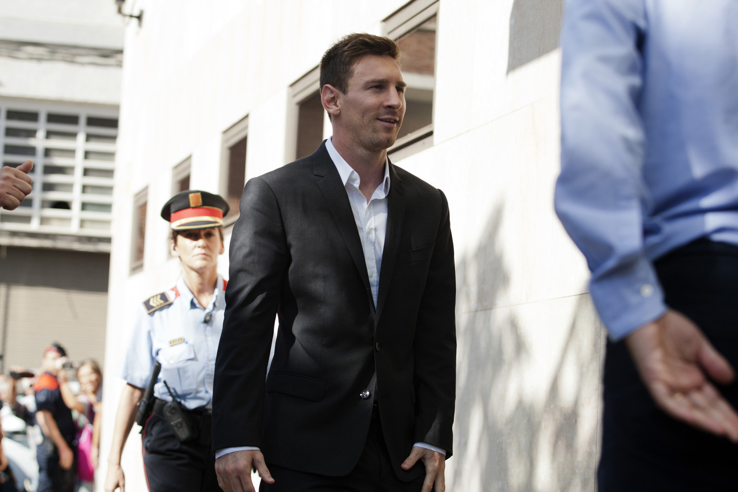 Sept. 27, 2013. Barcelona F.C. soccer player Lionel Messi, center, arrives at a court to answer questions in a tax fraud case near Barcelona.