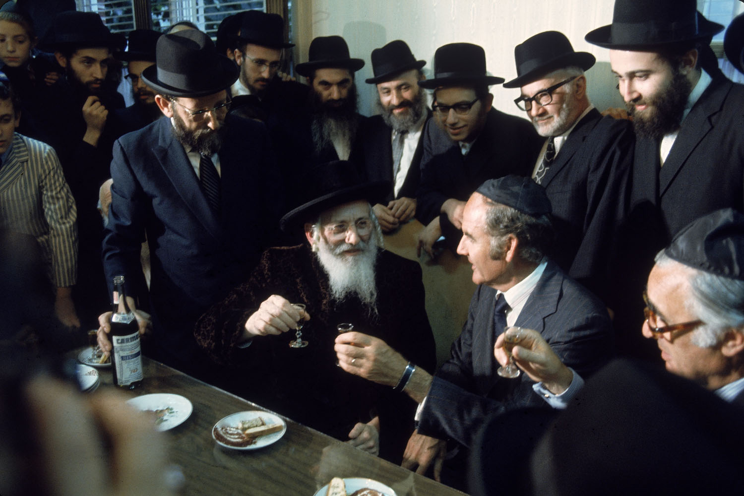 Democratic Presidential candidate George McGovern (seated, 2R) shares a toast with a group of Orthodox Jews while on the campaign trail.