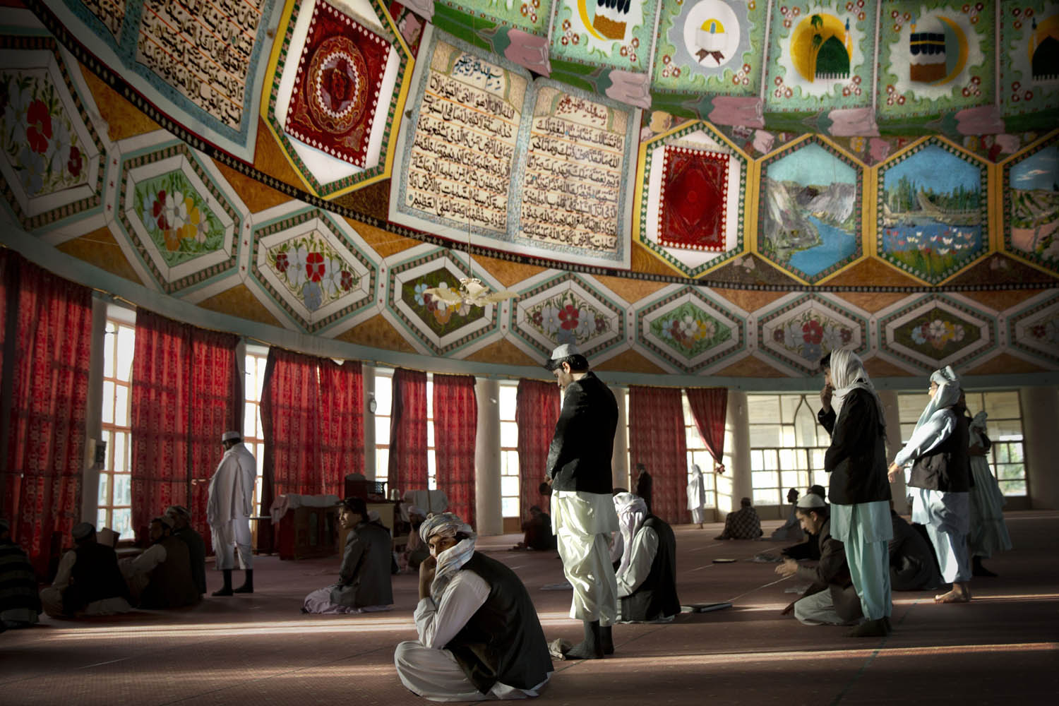 Oct. 30, 2013. Afghan men gather for prayers inside the Eid Gah mosque, one of Afghanistan's largest mosques in Kandahar, southern Afghanistan.