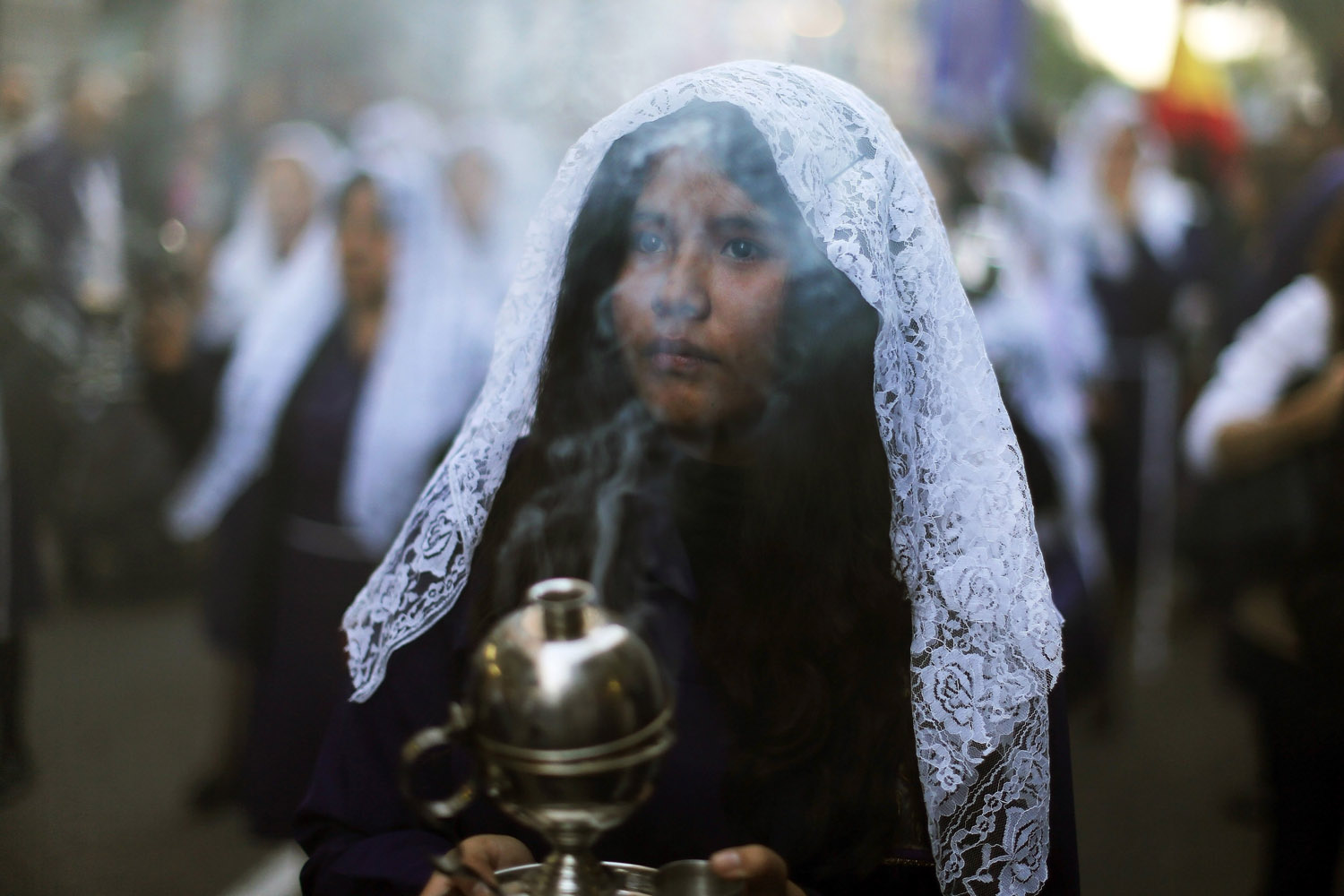 Oct. 27, 2013. Women participate in a procession honoring The Lord of Miracles,  Senor de los Milagros,  in Madrid.