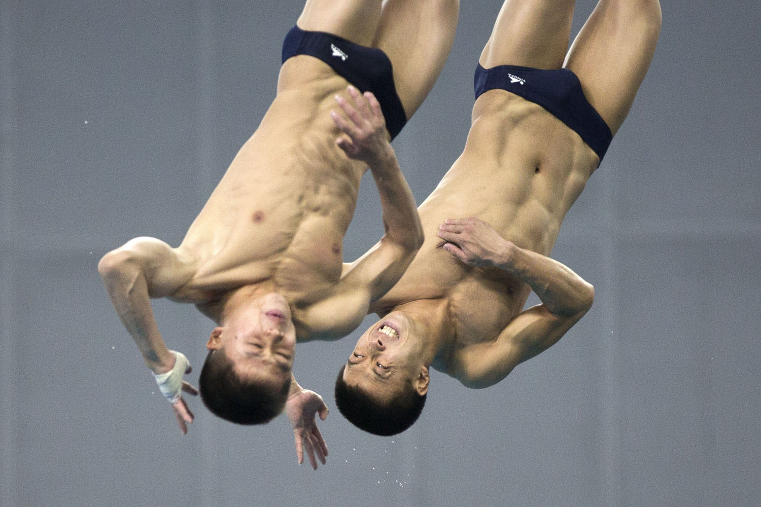 Oct. 7, 2013. North Korea's Kim Sun Bom and So Myong Hyok compete in the final of the men's 10-meter synchronized platform diving event at the sixth East Asian Games in Tianjin, China.