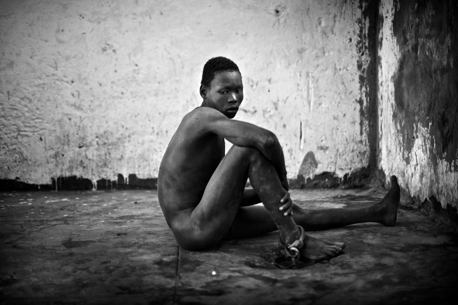 Severely mentally disabled men and women are shackled and locked away in Juba Central Prison for years on end. The new nation of South Sudan faces a tremendous challenge to build a modern country capable of caring for all of its citizens. Juba, Sudan. January 2011. Photo Robin Hammond/Panos