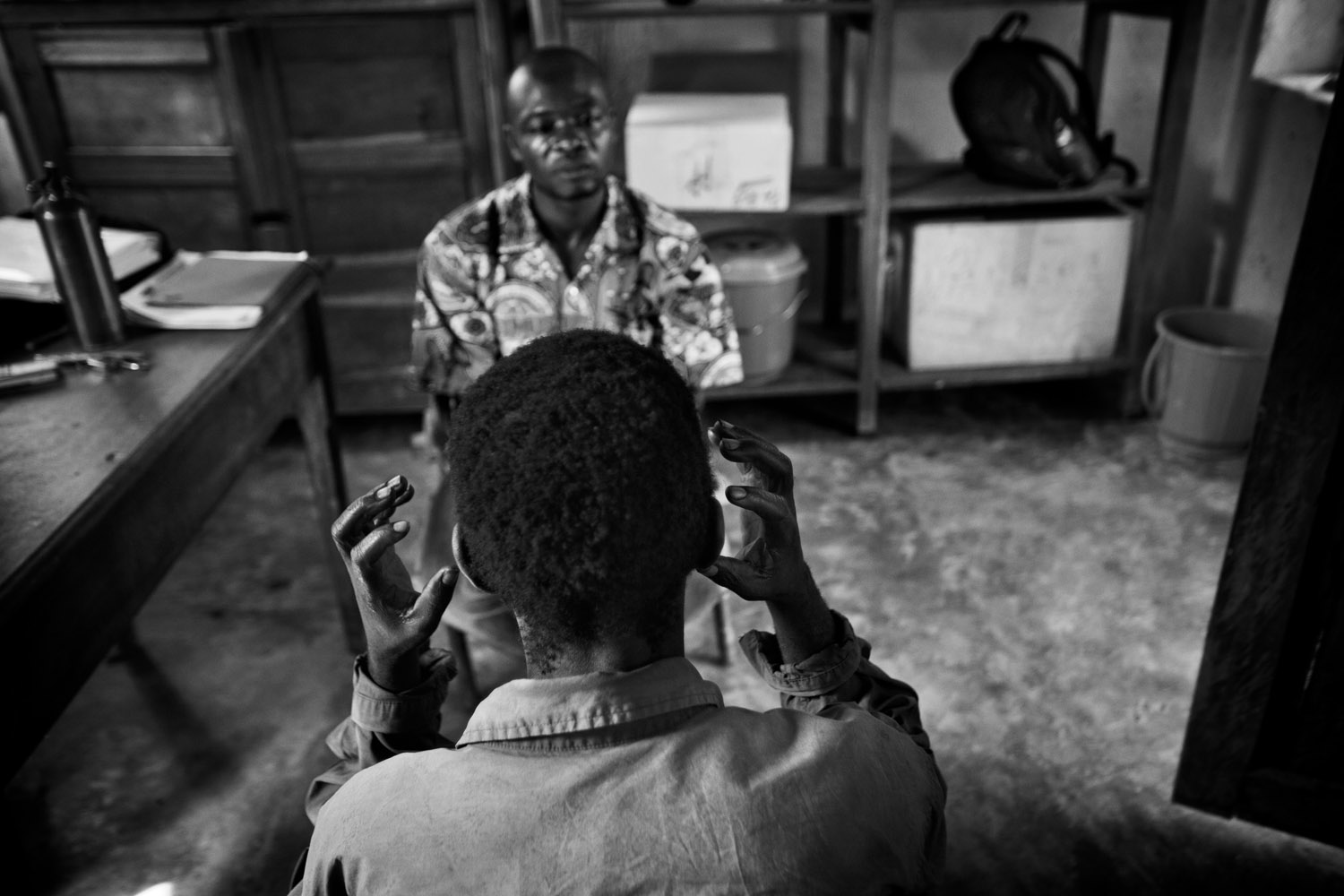 Mineyro Jean-Marie describes to Doctors Without Boarders Psychologist Serge Nzuya Mbwibwi how he felt when the Lord’s Resistance Army attacked his family and attempted to kidnap his daughter. Niangara, Democratic Republic of Congo. June 2011.