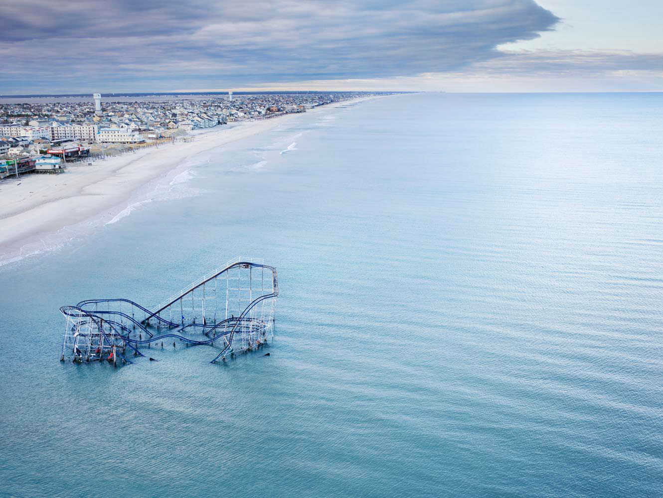 The Star Jet roller coaster at Casino Pier amusement park, once a Jersey Shore landmark, remains partly submerged in the Atlantic, Seaside Heights, N.J., 2012
