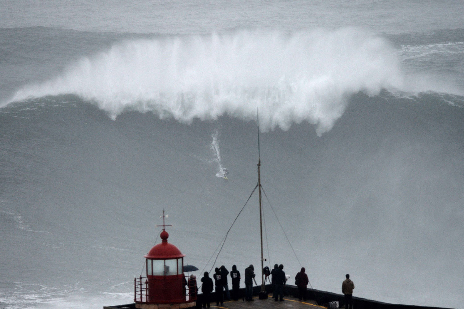 Oct. 28, 2013.
                              Brazilian big wave surfer Carlos Burle rides a wave in Nazare, central Portugal.