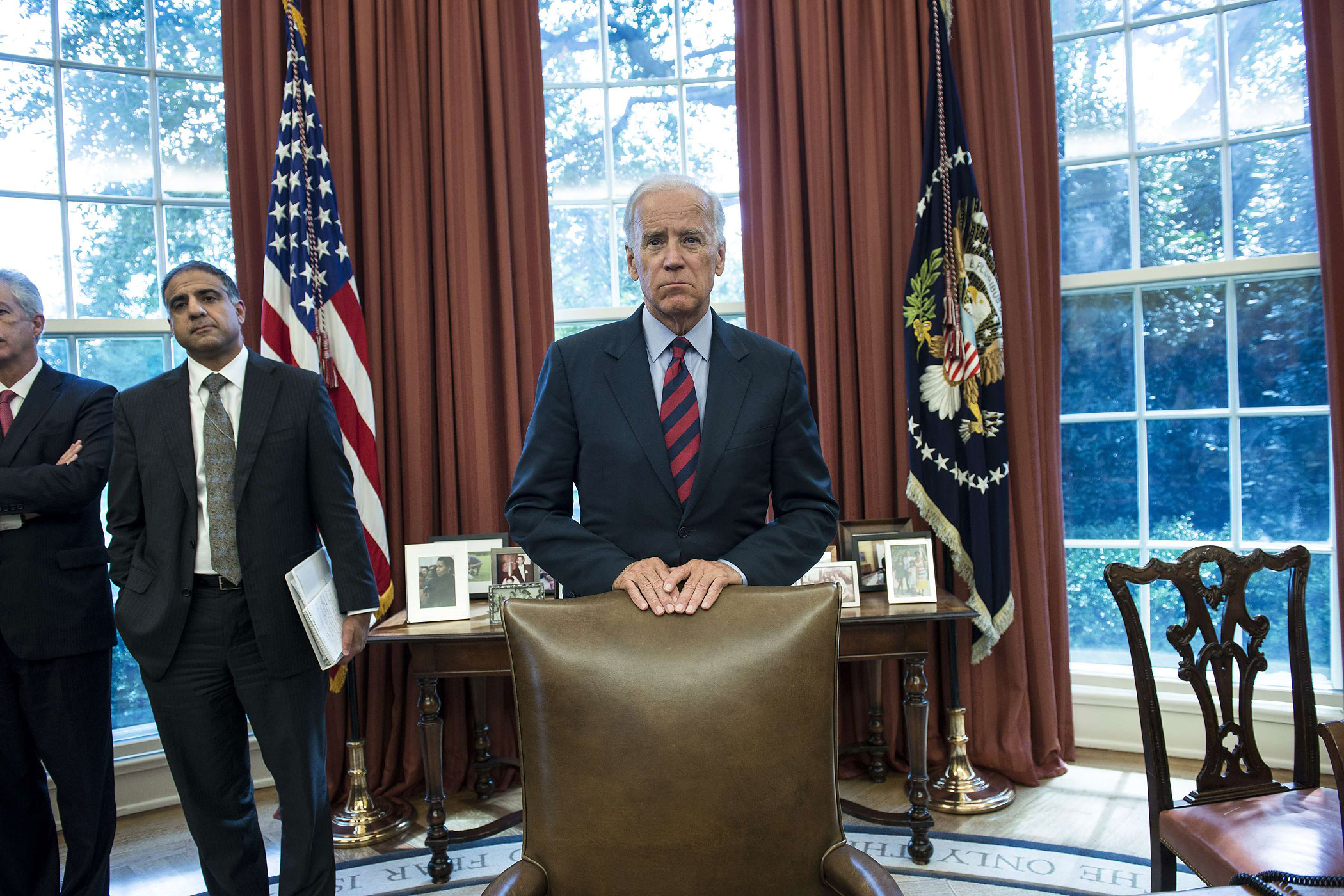 Sept. 13, 2013. Vice President Joseph R. Biden listens while the Emir of Kuwait Sheikh Sabah al-Ahmad Al-Jabar Al-Sabah  and President Barack Obama speak to the press after a meeting in the Oval Office of the White House in Washington.