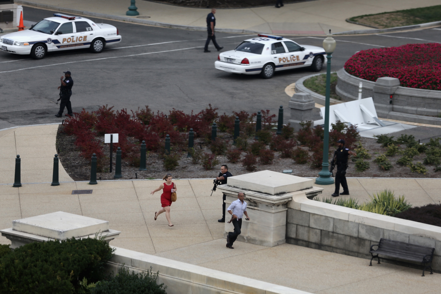 Oct. 3, 2013. Police close in on the U.S. Capitol as people run for cover after reports of a shooting  on Capitol Hill in Washington, DC.