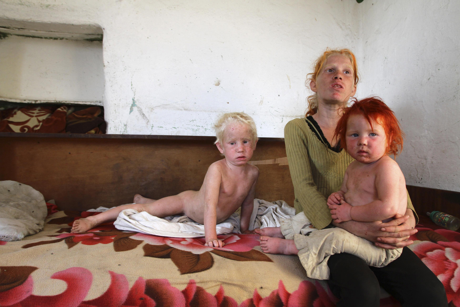 Oct. 24, 2013. The children of Roma woman Sasha Ruseva, 38, (not pictured) rest inside their home in Nikolaevo, southern Bulgaria.
