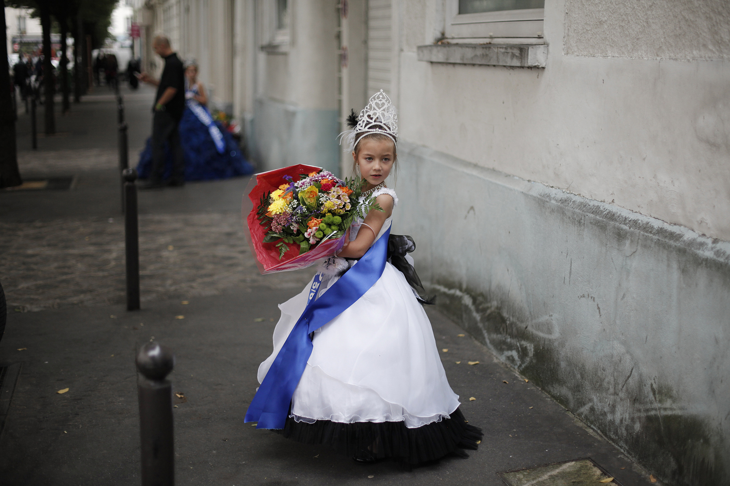 Sept. 28, 2013. Lou Hamrani, 6, walks in the street after attending the Mini Miss model beauty contest, in Paris.