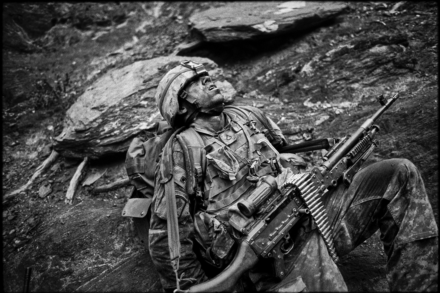 US Army Specialist Sterling Jones collapses in exhaustion during Operation Rock Avalanche in the Korengal Valley, Afghanistan. 2007.