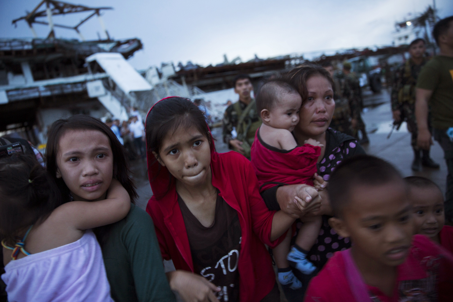 People effected by Haiyan Typhoon react after being unable to board a US military aid evacuation flight from Tacloban Airport in Tacloban, on Leyte Island in The Philippines on November 12, 2013.