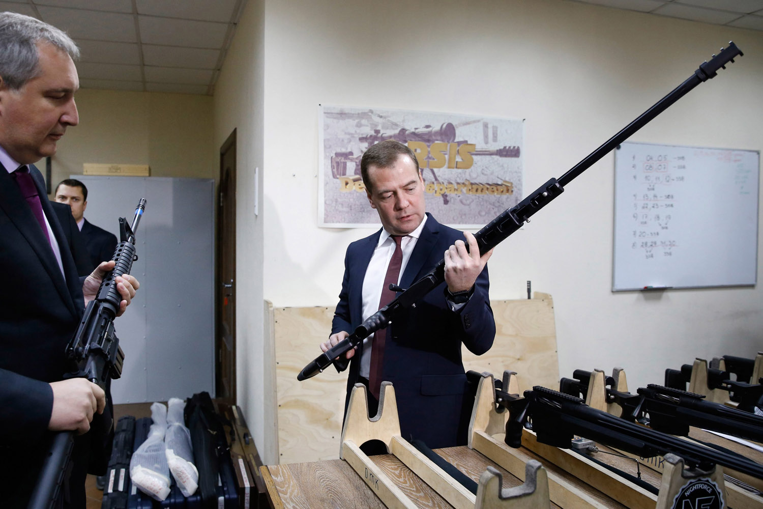 Nov. 19, 2013. Russian Prime Minister Dmitry Medvedev (R) inspects an unspecified model of Russian weapons manufacturer ORSIS as Russian Deputy Prime Minister Dmitry Rogozin (L) looks on during his visit to the Promtechnologies Group in Moscow.