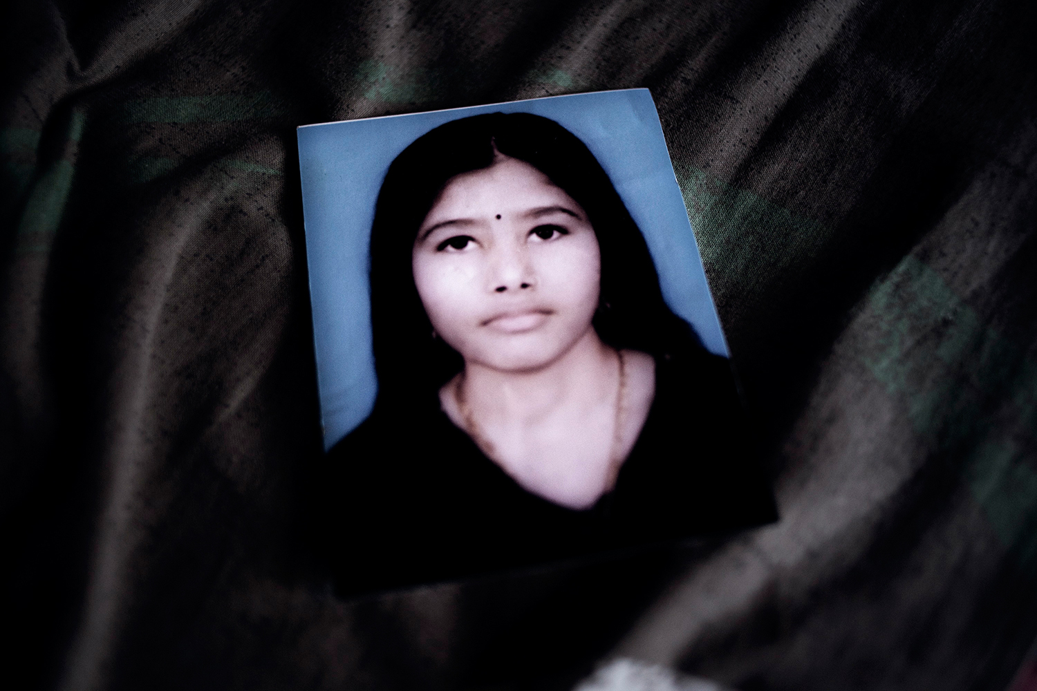 Halima, Dead worker from Rana Plaza. Halima’s husband Anis also dead.Halima’s sister in law Khadiza think that Halima is look like Taslima’s photo of that two person. But finally Anis mother say they are not. Savar, Dhaka, Bangladesh. 7th June 2013