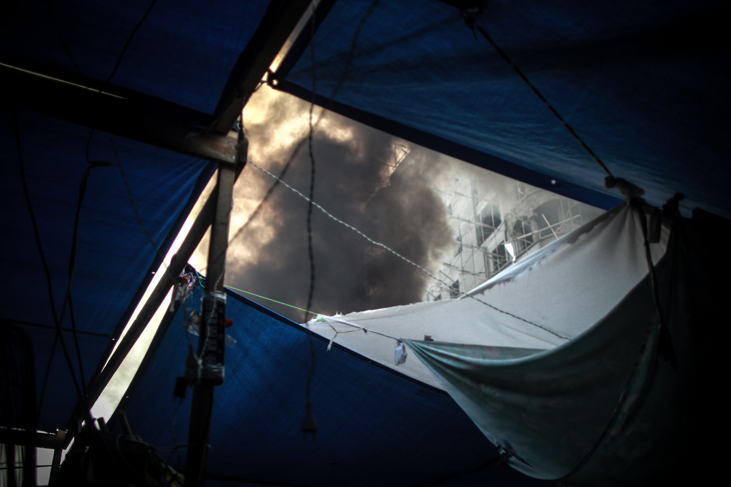 Aug. 14, 2013. Smoke is seen from a tent in Rabaa Adaweya square during the violent dispersal of the camp, where Morsi supporters had camped for 40 days.