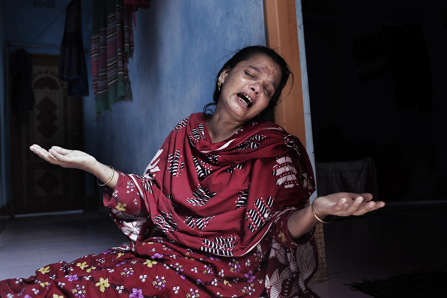 June 1, 2013. The mother of missing worker Suroj weeping over the loss of her son, Dhaka, Bangladesh.