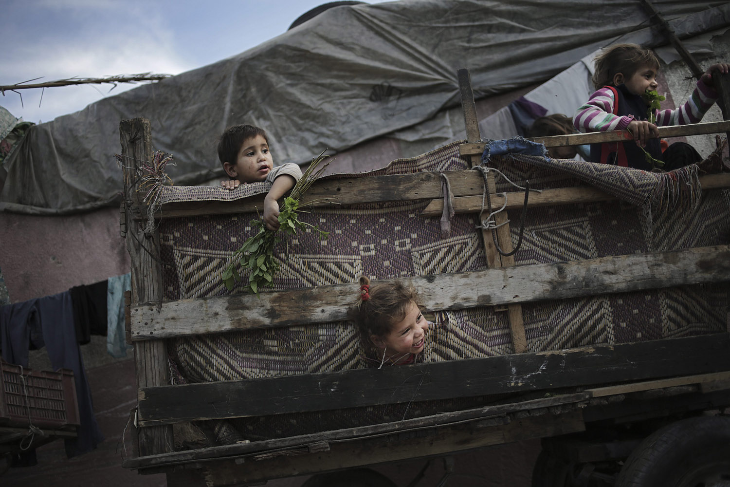 May 16, 2013. Palestinian refugee children play in a poverty-stricken quarter of the town of Beit Lahiya, northern Gaza Strip.