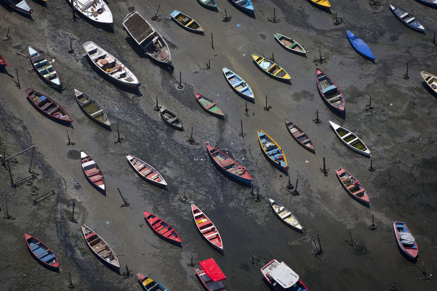 Nov. 19, 2013. Small boats sit on the shore of Guanabara Bay in the suburb of Sao Goncalo, across the bay from Rio de Janeiro, Brazil.