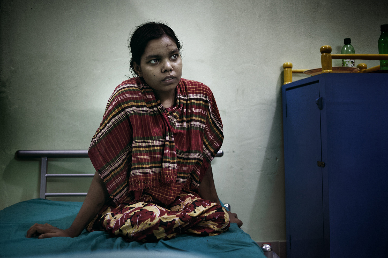 June 7, 2013. Rehana, 19, lost her two legs the garment factory collapse, Savar, Dhaka, Bangladesh.