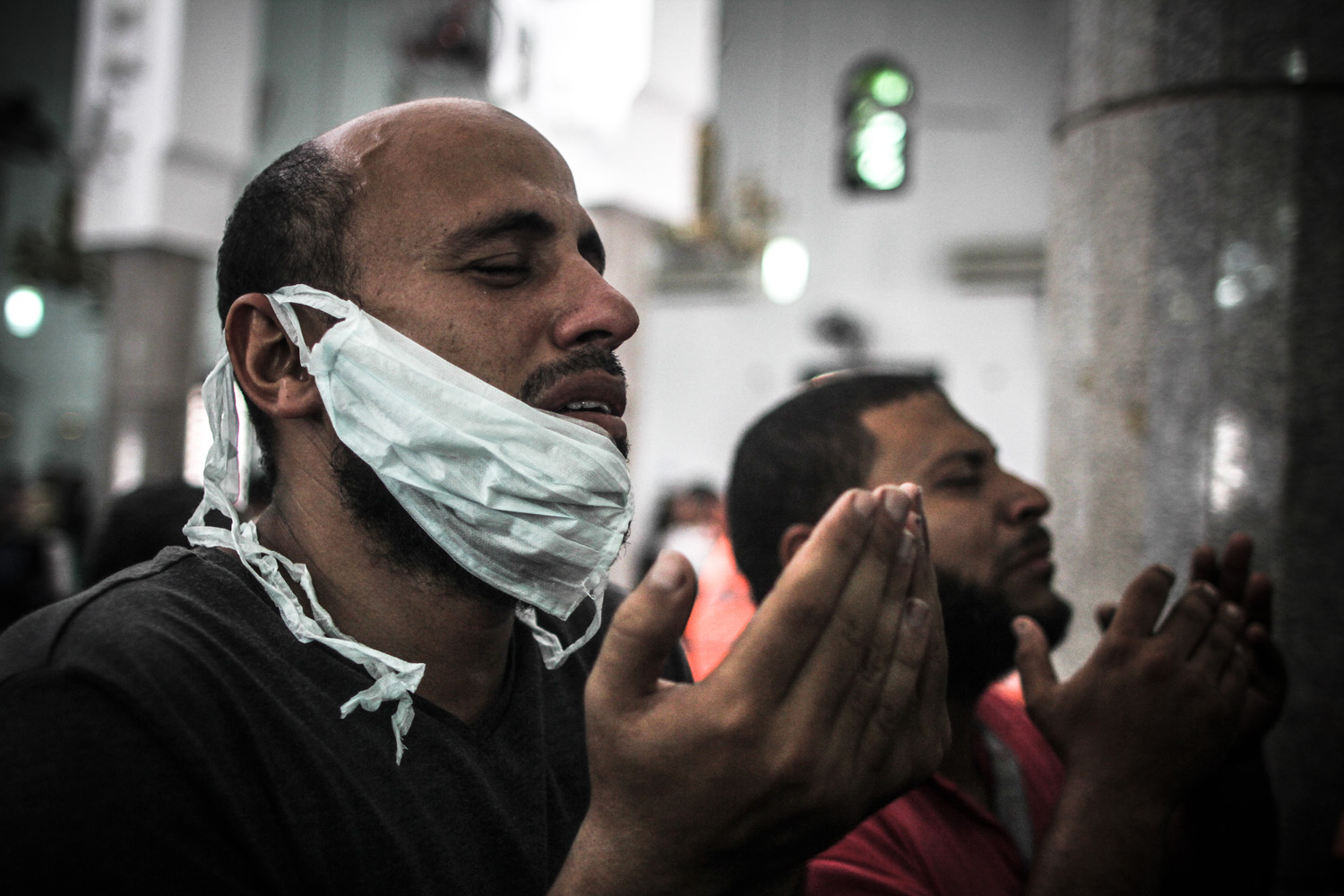 Aug. 15, 2013. Men grieve during funeral prayers for the victims of the Rabaa Adaweya massacre.