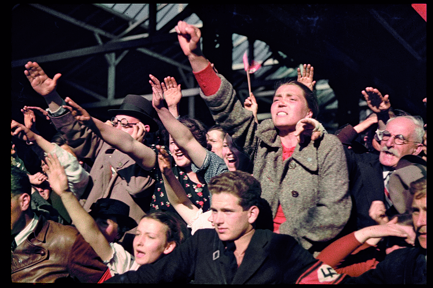 Austrians cheer Adolf Hitler during his 1938 campaign (before the Anschluss) to unite Austria and Germany.
